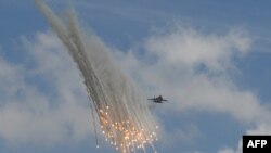 A Singapore Air Force F-15SG fighter jet takes part in a show at the Singapore Airshow.