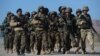 Afghan National Army soldiers march during training by Italian soldiers from NATO's Resolute Support Mission at a Military Training center on the outskirts of Herat, Feb. 9, 2017. 