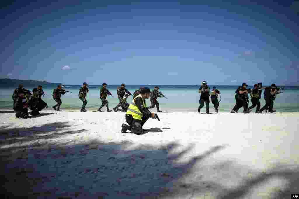 Policemen take part in a security measures exercise on Boracay island in the Philippines.