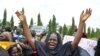 FILE—An unidentified mother cries out during a demonstration with others who have daughters among the kidnapped school girls of government secondary school Chibok, April 29, 2014, in Abuja, Nigeria