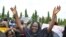 FILE—An unidentified mother cries out during a demonstration with others who have daughters among the kidnapped school girls of government secondary school Chibok, April 29, 2014, in Abuja, Nigeria