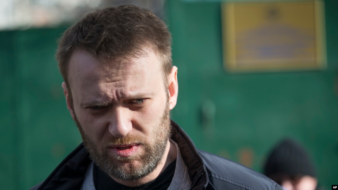 FILE - Russian opposition activist Alexei Navalny leaves a detention center in Moscow, Russia, Friday, March 6, 2015.