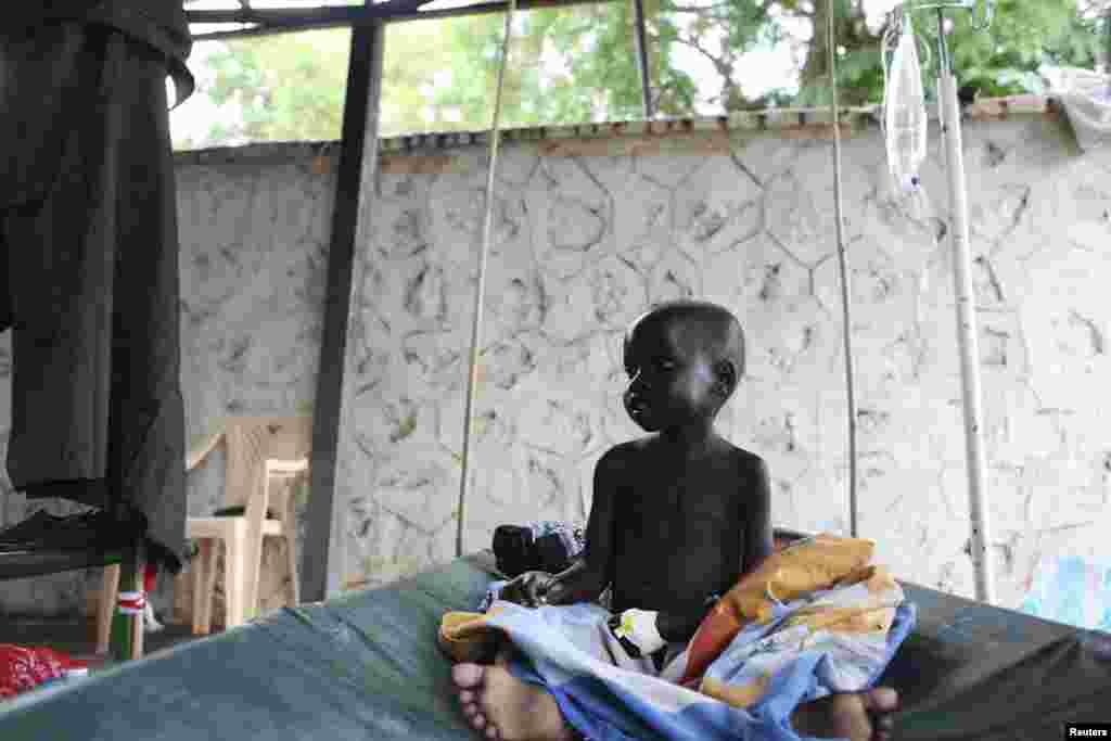 South Sudan&#39;s Child Act says all children have the right to free medical care. Eighteen months of fighting have worsened health in South Sudan, especially for children like this one awaiting cholera treatment at Juba Teaching Hospital in May, 2014.