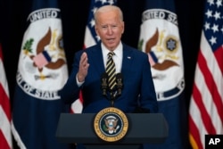 FILE - President Joe Biden delivers remarks to State Department staff, in Washington, Feb. 4, 2021.