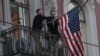 Employees take down the U.S. flag on the U.S. Consulate General in St. Petersburg, Russia, March 31, 2018.