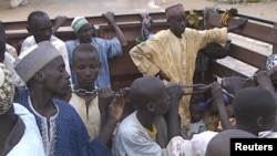 FILE - Former Nigerian hostages held by Boko Haram who were freed by the Cameroonian military arrive in Maroua, Cameroon, Dec. 5, 2015.