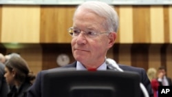 Joseph E. Macmanus, Permanent U.S. Representative to the United Nations, waits for the start of the IAEA board of governors meeting at the International Center in Vienna, Austria, March 6, 2013.