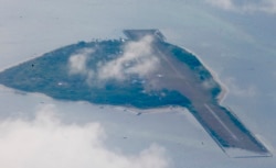 FILE - Philippine-claimed Thitu island, part of the Spratlys group of islands, is shown April 21, 2017.