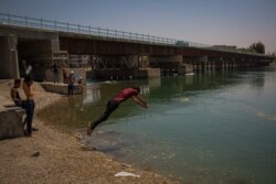 The new bridge over the Euphrates River was rebuilt and now links the two sides of Raqqa, Syria, Aug. 25, 2019. (Yan Boechat/VOA)