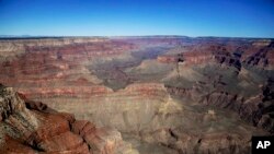 FILE - In this Oct. 5, 2013, file photo, the Grand Canyon National Park is covered in the morning sunlight as seen from a helicopter near Tusayan, Arizona.