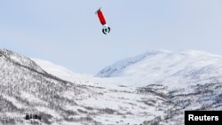 FILE - Qi Guangpu of China competes in the men's aerials race at the FIS Freestyle World Ski Championships in Voss, Norway, March 7, 2013. 
