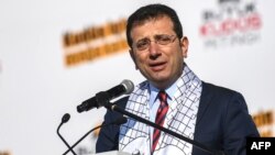 FILE - Ekrem Imamoglu , Mayor of Istanbul metropolitan municipality speaks during a rally at Yenikap Square, in Istanbul, to protest against the US-made peace plan, also known as the ‘Agreement of the Century.’ 