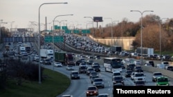 FILE - Travelers are stuck in a traffic jam as people hit the road before the busy Thanksgiving Day weekend in Chicago, Illinois, Nov. 21, 2017.