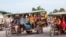 Cambodian garment workers share a tuk-tuk after work, Phnom Penh, Cambodia, May 25, 2017. (Khan Sokummono/VOA Khmer) 