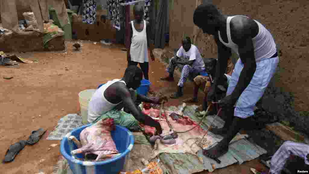 A family prepares their Sallah ram for cooking after prayers in Abuja.