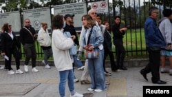 People who had an appointment scheduled for the visa process to the United States and were canceled, wait outside the United States embassy for rescheduling information, in Bogota, Colombia, Jan. 27, 2025. 