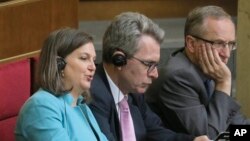 U.S. Assistant Secretary of State Victoria Nuland, foreground, listens, during a parliament session in Kiev, Ukraine Thursday, July 16, 2015. 