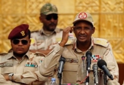 Gen. Mohammed Hamdan Dagalo, the deputy head of the military council, speaks during military-backed women's rally, in Khartoum.