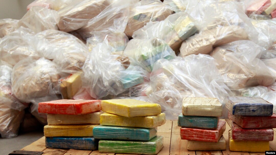 FILE - Cocaine from Britain's largest ever cocaine seizure is seen on display in London, Aug. 3, 2011. 