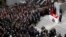 People attend the funeral ceremony of prosecutor Mehmet Selim Kiraz at the Justice Palace in Istanbul, Turkey, April 1, 2015. 