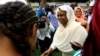 FILE - Sudan's member of sovereign council Aisha Musa greets players before Sudan's first women's league soccer match at the Khartoum stadium, Khartoum, Sudan Sept. 30, 2019.