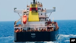 FILE - This photograph shared by the Indian navy on the X platform shows the hijacked ship MV Ruen on March 16, 2024. The Indian navy rescued 19 crew members from the ship, then, on March 29, intercepted a fishing vessel in the Arabian Sea after a suspected hijacking.