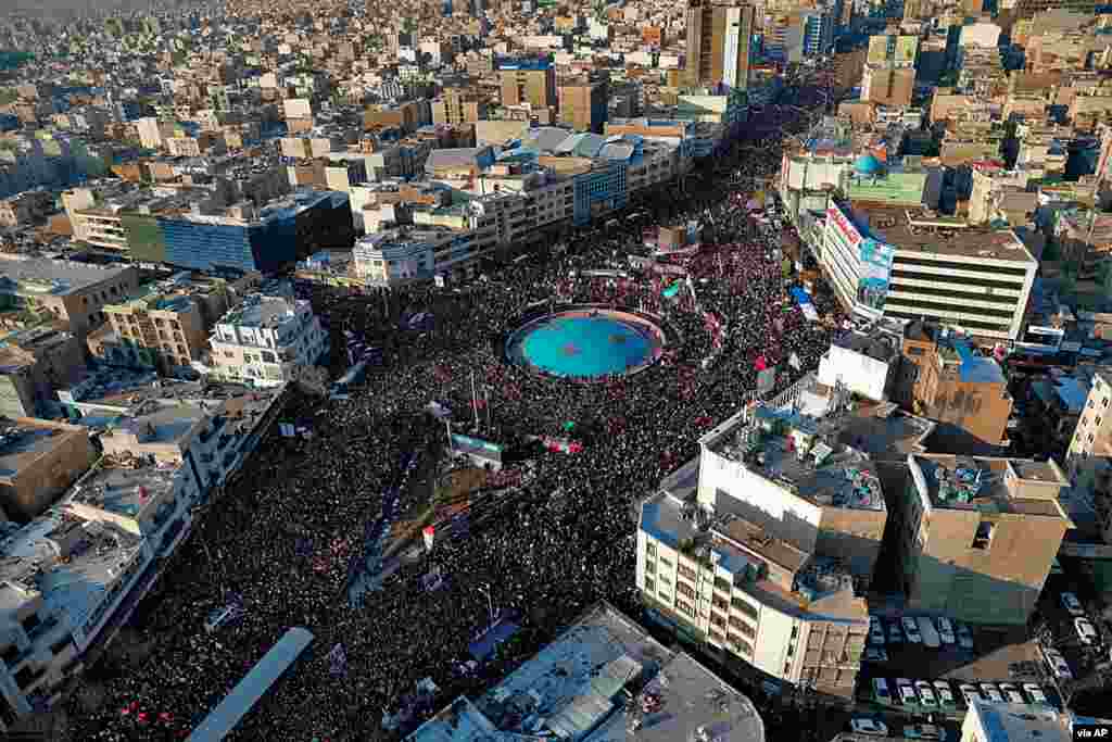 In this aerial photo released by an official website of the office of the Iranian supreme leader, mourners attend a funeral ceremony in Tehran for Gen. Qassem Soleimani and his comrades, who were killed in Iraq in a U.S. drone strike. 