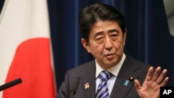 Japanese Prime Minister Shinzo Abe speaks during a press conference at his official residence after summit meetings with 10 Southeast Asian countries, in Tokyo, Dec. 14, 2013.