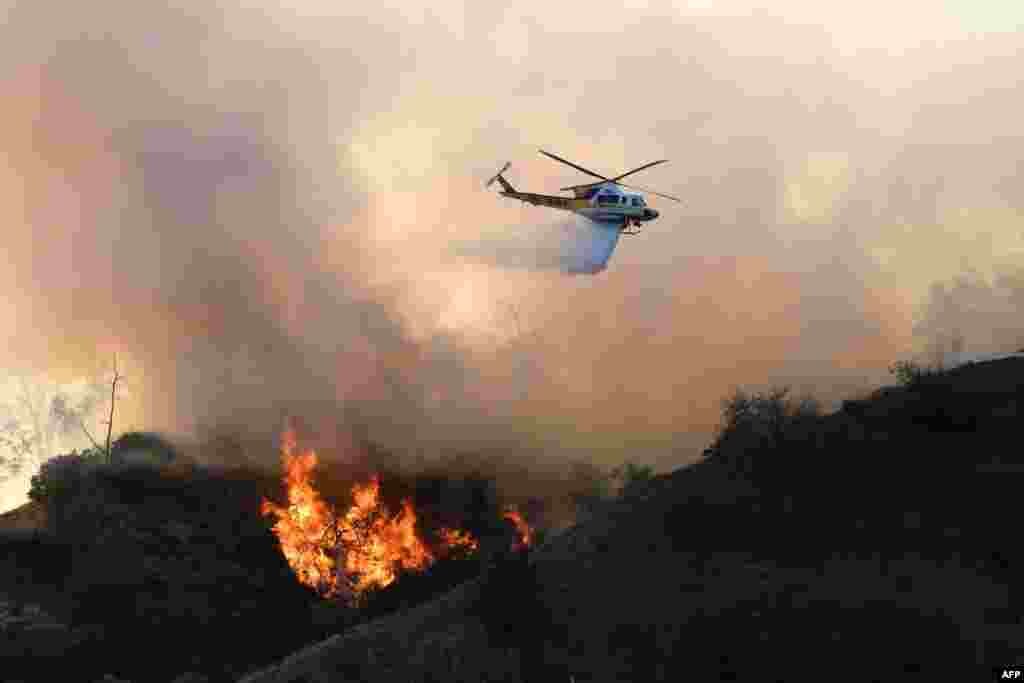 Flames from a wildfire burn a portion of Griffith Park in Los Angeles, California.