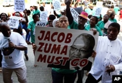 FILE - Demonstrators protest against South African President Jacob Zuma in Pretoria, South Africa, April 4, 2017.