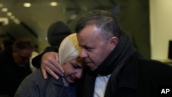 Nadeen, who was waiting for the release of her brother, Ahamd al-Seifi, after he served 15 years in Israeli jails, is comforted by a relative, Feb. 23, 2025.