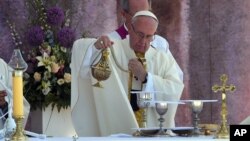 Pope Francis incenses the altar as he celebrates a Holy Mass in Brzegi, near Krakow, Poland, July 31, 2016. 