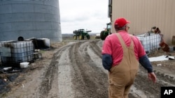 Blake Hurst, a corn and soybean farmer and president of the Missouri Farm Bureau, walks to the tractor shed on his farm in Westboro, Missouri, April 4, 2017. U.S. President Donald Trump has vowed to redo the North American Free Trade Agreement, but NAFTA has widened access to Mexican and Canadian markets, boosting U.S. farm exports and benefiting many farmers. Hurst says NAFTA has been good for his business and worries that he'll lose out in a renegotiation. 