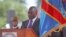 Congo President Joseph Kabila, center left, stands during his swearing-in ceremony for another term, in Kinshasa, Dec. 20, 2011.