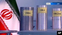 FILE - In this June 6, 2018, image taken from video on Islamic Republic Iran Broadcasting state-run TV, three versions of centrifuges are shown in a live TV program from Natanz, an Iranian uranium enrichment plant.