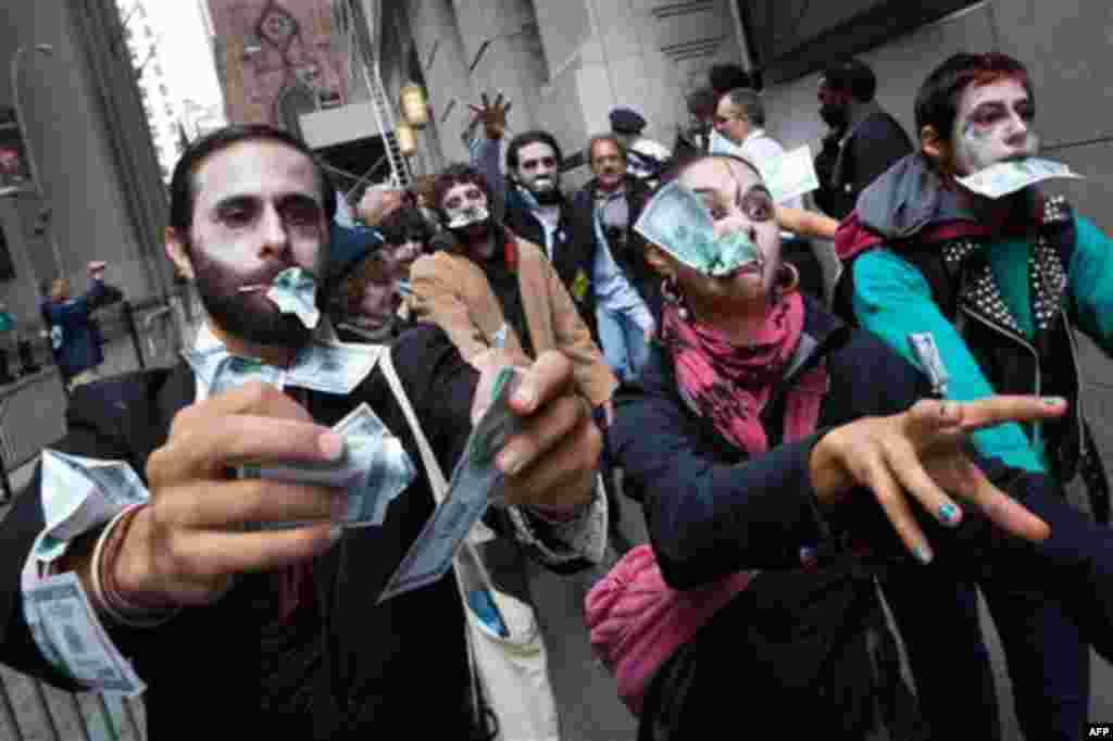 Protesters from Occupy Wall Street march through New York's financial district dressed as "corporate zombies" Monday, Oct. 3, 2011. The protests have gathered momentum and gained participants in recent days as news of mass arrests and a coordinated media 
