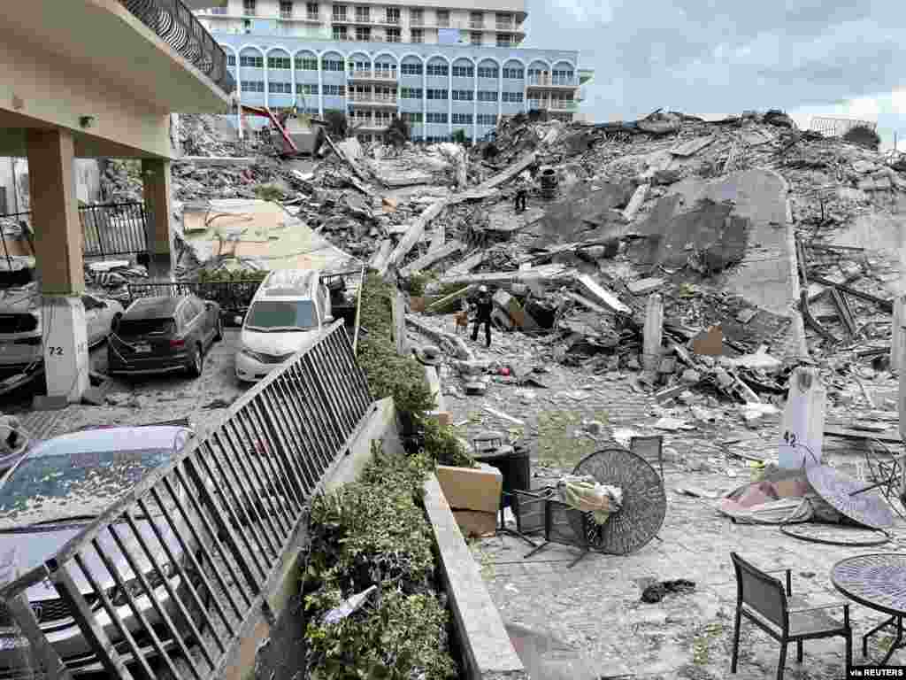 Emergency personnel work at the site of a collapsed building in Miami Beach, Florida. (Miami-Dade Fire Rescue/Handout)