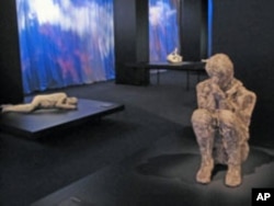 Plaster casts made from the fossilized imprints of Pompeiians who perished