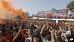 Egyptian soccer fans of Al-Ahly football club celebrate in front of their club premises in Cairo, Egypt, January 26, 2013. 