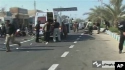 An ambulance attends the scene of a bomb blast in this image taken from TV, in Chahbahar Iran, 15 Dec 2010
