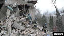 Rescuers work at the site of a maternity ward of a hospital destroyed by a Russian missile attack, as their attack on Ukraine continues, in Vilniansk, Zaporizhzhia region, Ukraine Nov. 23, 2022. 