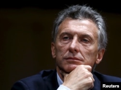 FILE - Argentina's President Mauricio Macri smiles during a news conference in Buenos Aires.