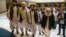 Mullah Abdul Ghani Baradar, the Taliban group's top political leader, third from left, arrives with other members of the Taliban delegation for talks in Moscow, Russia, May 28, 2019. 