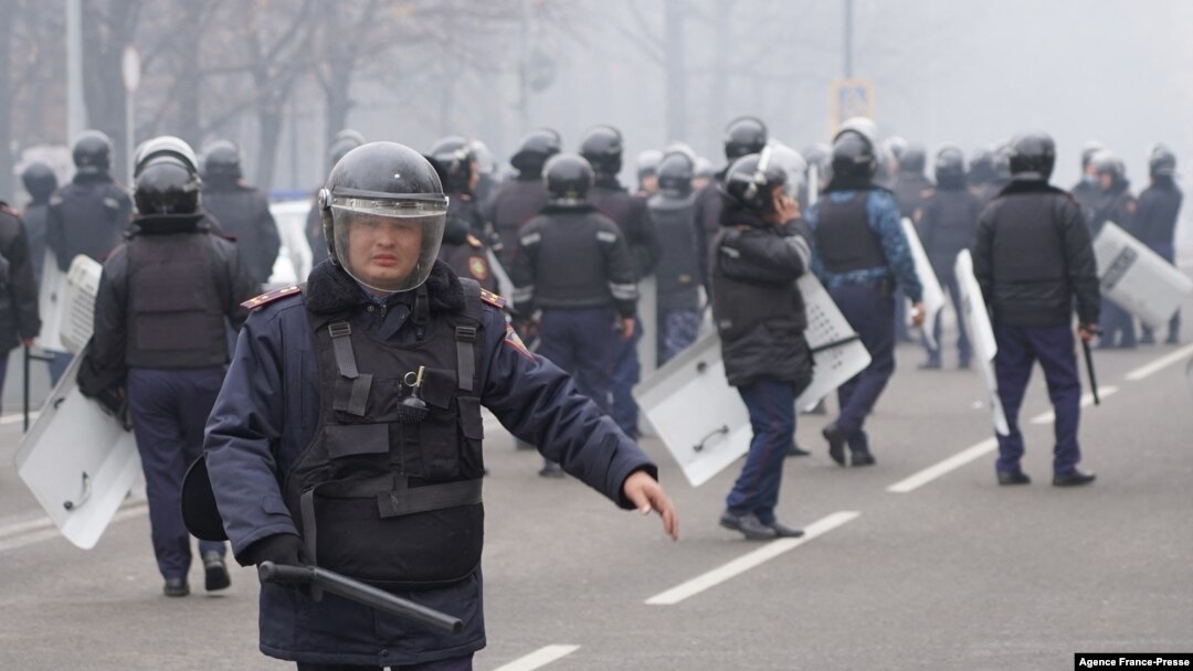 Riot police officers patrol in a street as unprecedented protests over a hike in energy prices spun out of control, in Almaty, Kazakhstan, Jan. 5, 2022. 