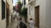A photo of tourists visiting the Tunis Medina. Ben Gacem suggests Tunisia hasn't sold it's 'best story' to foreigners flocking to the country. (VOA/Lisa Bryant)