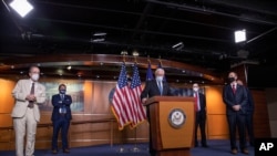 House Majority Leader Steny Hoyer speaks, accompanied by other Democratic House members, during a news conference on Capitol Hill, after a meeting at the White House, in Washington, June 30, 2020. 