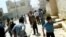 This image made from amateur videoshows Syrians running from gun shots in Khan Sheikhoun, Idlib, Syria, May 15, 2012.