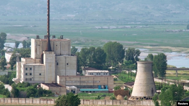 A North Korean nuclear plant is seen before demolishing a cooling tower (R) in Yongbyon, in this photo taken June 27, 2008 and released by Kyodo. North Korea is to restart the mothballed Yongbyon nuclear reactor that has been closed since 2007.