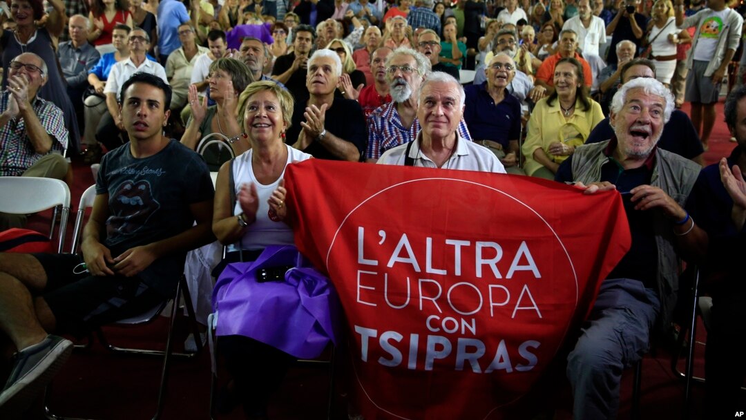 Supporters of left-wing Syriza party react as they watch the election results at the party’s main electoral center in Athens, Sunday, Sept. 20, 2015. 