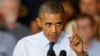 President Barack Obama gestures as he speaks to workers at the Ford Kansas City Stamping Plant in Liberty, Missouri, Sept. 20, 2013.